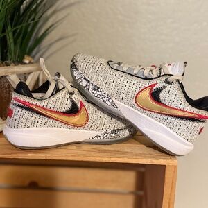 Nike Gold and Black Sneakers with Classic Style